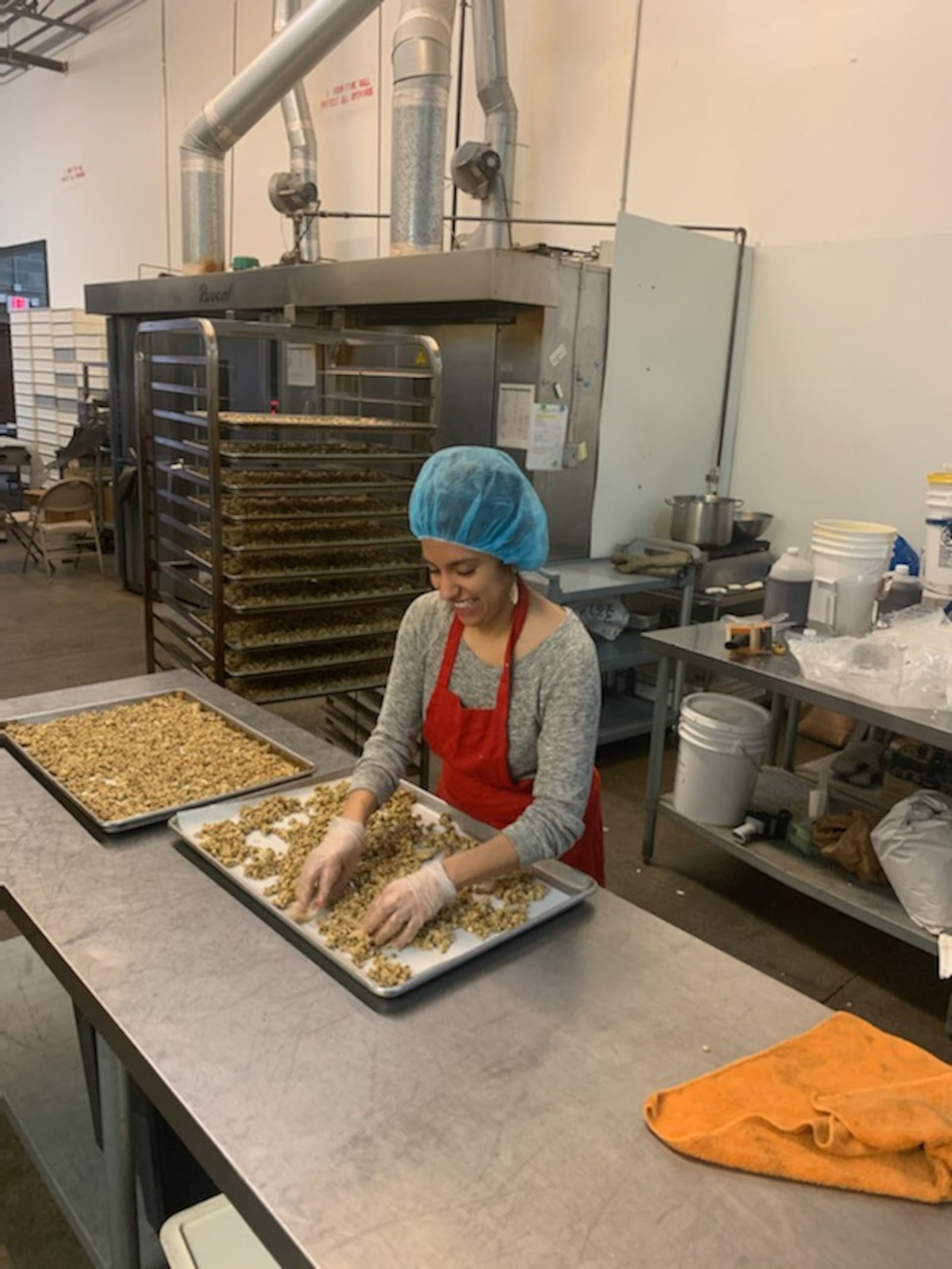 Jade Lopez works in Pure Bliss Organics’ Marietta manufacturing facility making granola. 
Courtesy of Pure Bliss Organics