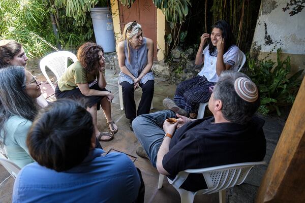 Rabbi Analia Bortz (center) listens to a member of Asociación Nuevo Horizonte, a coalition of Maya women fighting for their rights in Guatemala. CONTRIBUTED BY CHRISTOPHER DILTS / AJWS