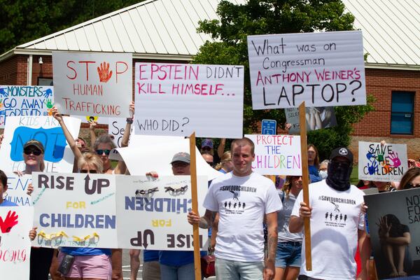 Standing with the Children protesters assemble at Woodstock Elementary before heading to the Elm Street Event Green in Woodstock Saturday, August 22, 2020.  STEVE SCHAEFER FOR THE ATLANTA JOURNAL-CONSTITUTION