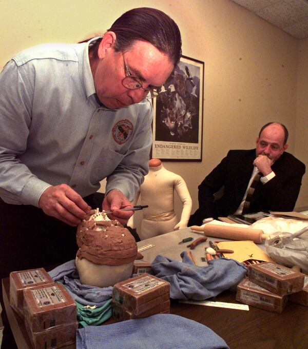 990316 Stone Mountain, Ga: Investigator Harvey Pratt, artist and investigator of Oklahoma Bureau of Investigation is reconstructing the face of the skeleton of a 5-7 yr old boy found in the woods near a cemetery. In the background is Investigator Woody Hall (right) who is in charge of the investigation. March 16,1999 (Renee' Hannans/AJC).