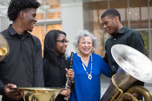 Azira G. Hill poses with young musicians. She helped establish Atlanta Symphony Orchestra’s Talent Development Program to identify and nurture talented African American and Latino music students.  (Atlanta Symphony Talent Development Program/Facebook)