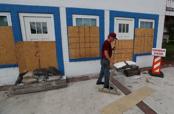 September 3, 2019 St. Mary's: Caretaker Perry Matheson makes some last minute preperations to a home that normally gets flood waters late Tuesday evening as Hurricane Dorian approaches the area on September 3, 2019, in St. Mary's.   Curtis Compton/ccompton@ajc.com