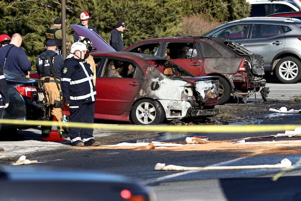 First responders work the scene after a plane crashed in a parking lot of a retirement community Sunday, March 9, 2025, in Manheim Township, Pa. (Zach Gleiter/The Patriot-News via AP)