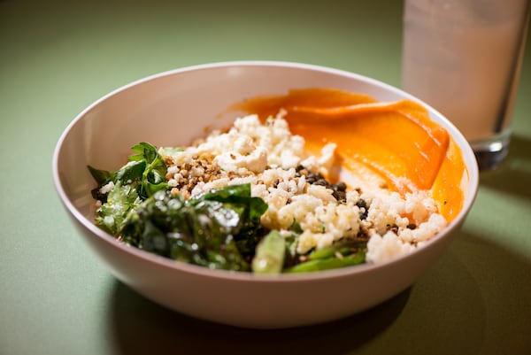  Recess Casablanca Bowl with beluga lentils, buckwheat crunchies, puffed rice, moroccan-spiced carrot puree, swiss chard, seared okra, feta, and herb salad. Photo credit- Mia Yakel.