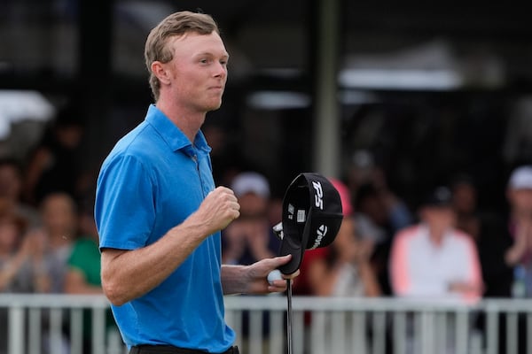 Ryggs Johnston of the United States reacts after winning the Australian Open golf championship at the Kingston Heath Golf Club in Melbourne, Australia, Sunday, Dec. 1, 2024. (AP Photo/Asanka Brendon Ratnayake)