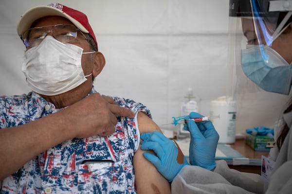 Some people are having delayed reactions to their first dose of a COVID vaccine, with their arms turning red, sore, itchy and swollen a week or so after the shot. (Mike Kai Chen/The New York Times)