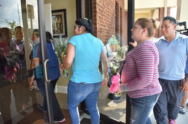 July 12, 2017 Lawrenceville - Friends, family and community members arrive for the visitation for the victims - Martin Romero, 33, and four siblings, including 1-year-old Axel, 4-year-old Dillan, 7-year-old Dacota and 10-year-old Isabela Martinez - at Byrd and Flanigan Crematory & Funeral Service in Lawrenceville. on Wednesday, July 12, 2017. HYOSUB SHIN / HSHIN@AJC.COM