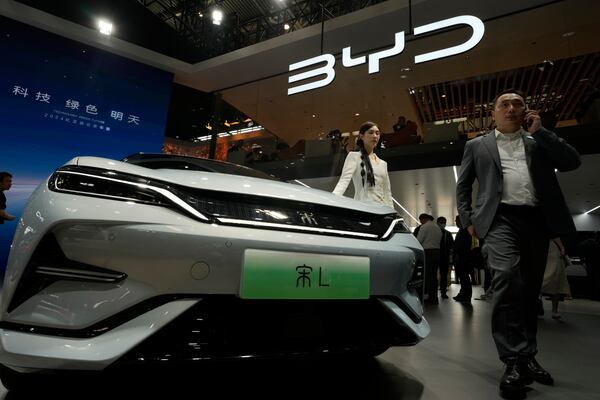 A model poses near the BYD Song L EV car during Auto China 2024 held in Beijing, April 25, 2024. In May 2024, President Joe Biden expanded tariffs on Chinese made electric vehicles to protect U.S. EVs. (AP File Photo/Ng Han Guan)