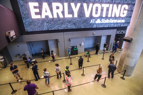 Voters wait to cast ballots at State Farm Arena in Atlanta on Oct. 12, the first day of early voting. Georgia's emergence as a swing state may make it an unusually attractive target for foreign agents or political operatives who want to disrupt the 2020 elections. (John Spink / John.Spink@ajc.com)

