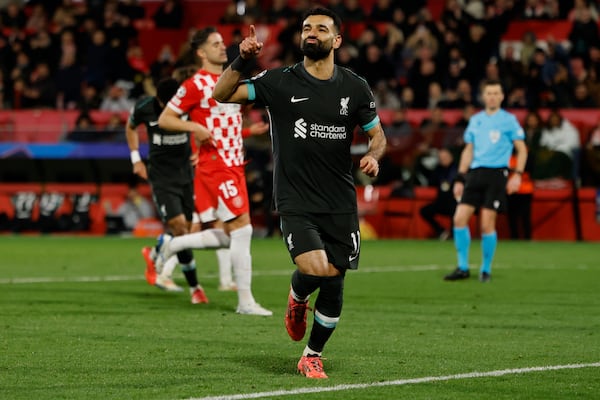 Liverpool's Mohamed Salah celebrates after scoring the opening goal during the Champions League soccer match between Girona and Liverpool at Estadi Montilivi in ​​Girona, Spain, on Tuesday, December 10, 2024. (AP Photo/Joan Monfort)