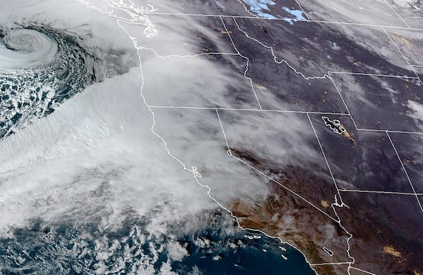 This Nov. 19, 2024 satellite image provided by the National Oceanic and Atmospheric Administration shows an atmospheric river moving in on Northern California and the Pacific Northwest. (NOAA via AP)