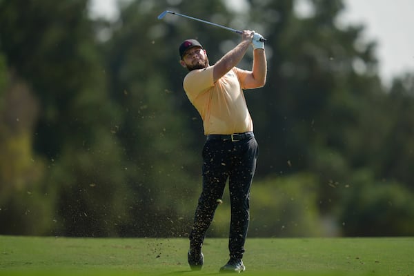 Tyrell Hatton of England plays his second shot on the 2nd hole during the second round of World Tour Golf Championship in Dubai, United Arab Emirates, Friday, Nov. 15, 2024. (AP Photo/Altaf Qadri)