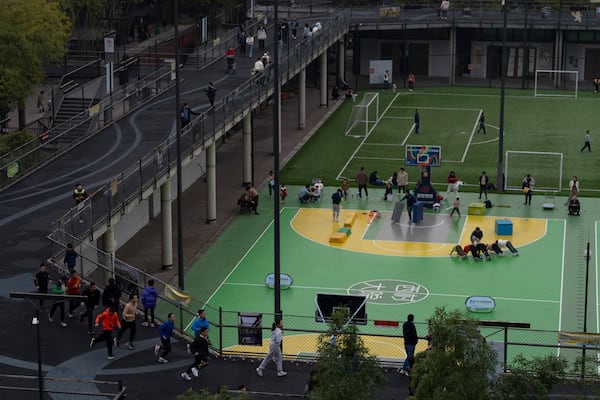 Visitors enjoy the sports facilities at the West Village project by Pritzker Architecture Prize winner Chinese architect Liu Jiakun in Chengdu in southwestern China's Sichuan province on Sunday, March 2, 2025. (AP Photo/Ng Han Guan)