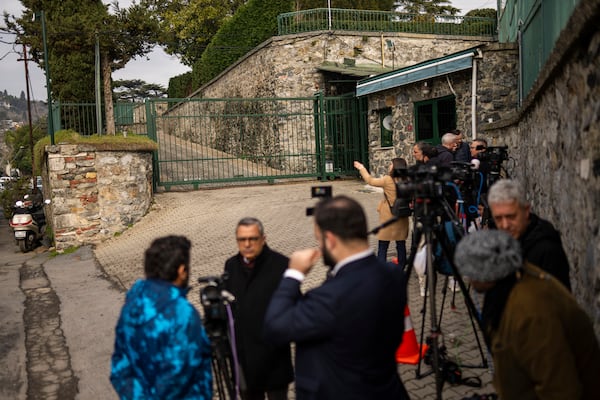 Journalists work outside U.S. Consul General residence where Russian and U.S. diplomats are met to discuss operation of embassies, in Istanbul, Turkey, Thursday, Feb. 27, 2025. (AP Photo/Francisco Seco)