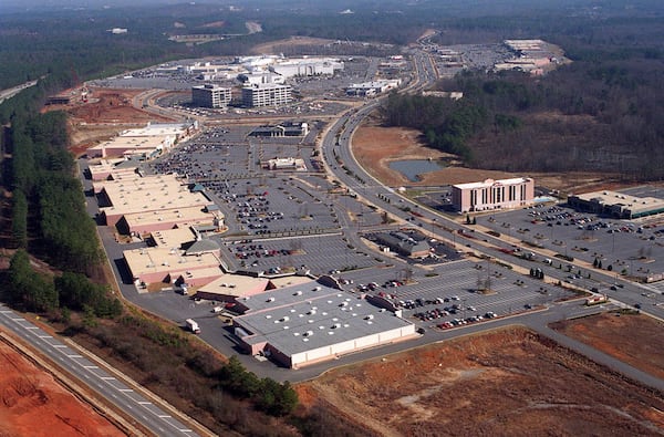 This aerial photo from 1997 shows the sprawling North Point Mall in the background. The area around Ga. 400 would continue to grow and grow into one of metro Atlanta's most important arteries. (John Spink/AJC)