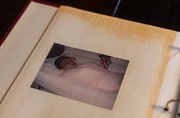 A photo in a McKnight family album shows Shirley McKnight in her casket wearing her trademark red lipstick.