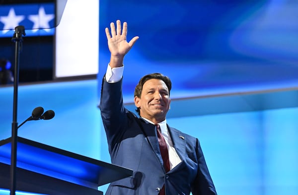 Florida Gov. Ron DeSantis, during his speech Tuesday at the Republican National Convention, invoked Donald Trump's clenched-fist admonition to “fight, fight, fight” after a bullet clipped his ear at his rally Saturday in rural Pennsylvania. (Hyosub Shin / AJC)