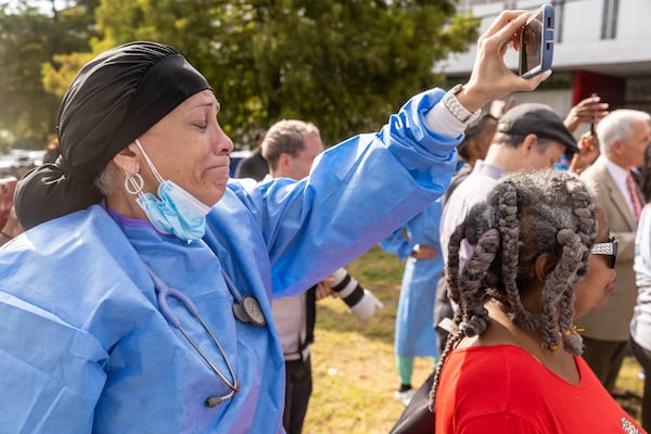 WellStar Atlanta Medical Center nurse Melody Reddington becomes emotional listening to Stacey Abrams talk at a press conference outside the hospital Friday, Sep. 02, 2022. Steve Schaefer/steve.schaefer@ajc.com)