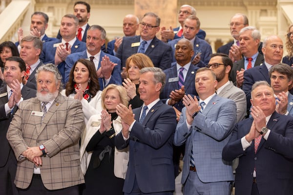 Legislators and officials clap before Gov. Brian Kemp signs the budget bill at the Capitol in Atlanta on Crossover Day, Thursday, March 6, 2025. (Arvin Temkar /Atlanta Journal-Constitution via AP)