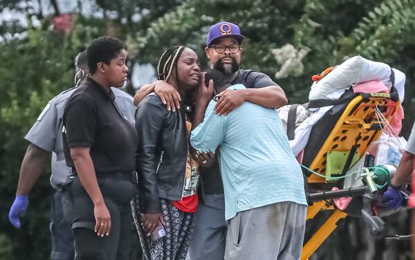 A crowd gathered outside a home on Young Knoll while a DeKalb County police investigation was underway Monday morning.