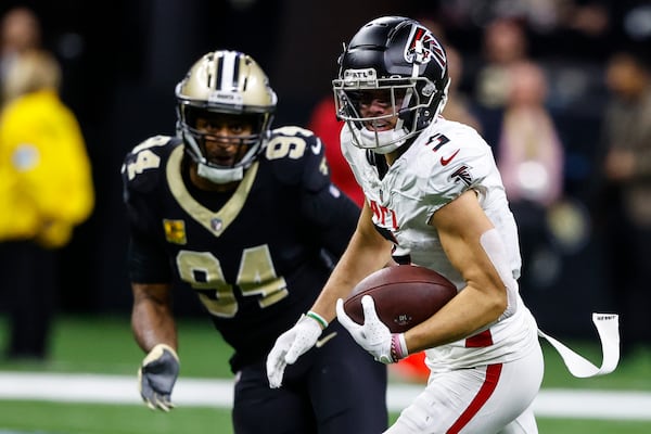 Atlanta Falcons wide receiver Drake London (5) runs against New Orleans Saints defensive end Cameron Jordan (94) during the second half of an NFL football game, Sunday, Nov. 10, 2024, in New Orleans. (AP Photo/Butch Dill)