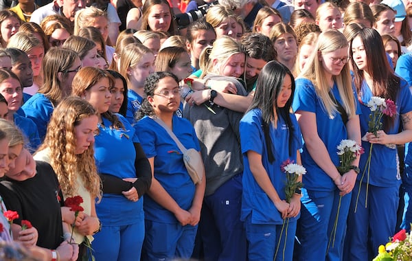 Students gather at Tate Plaza on Feb. 26, 2024, after a nursing student from a nearby school was killed last week on the UGA campus.