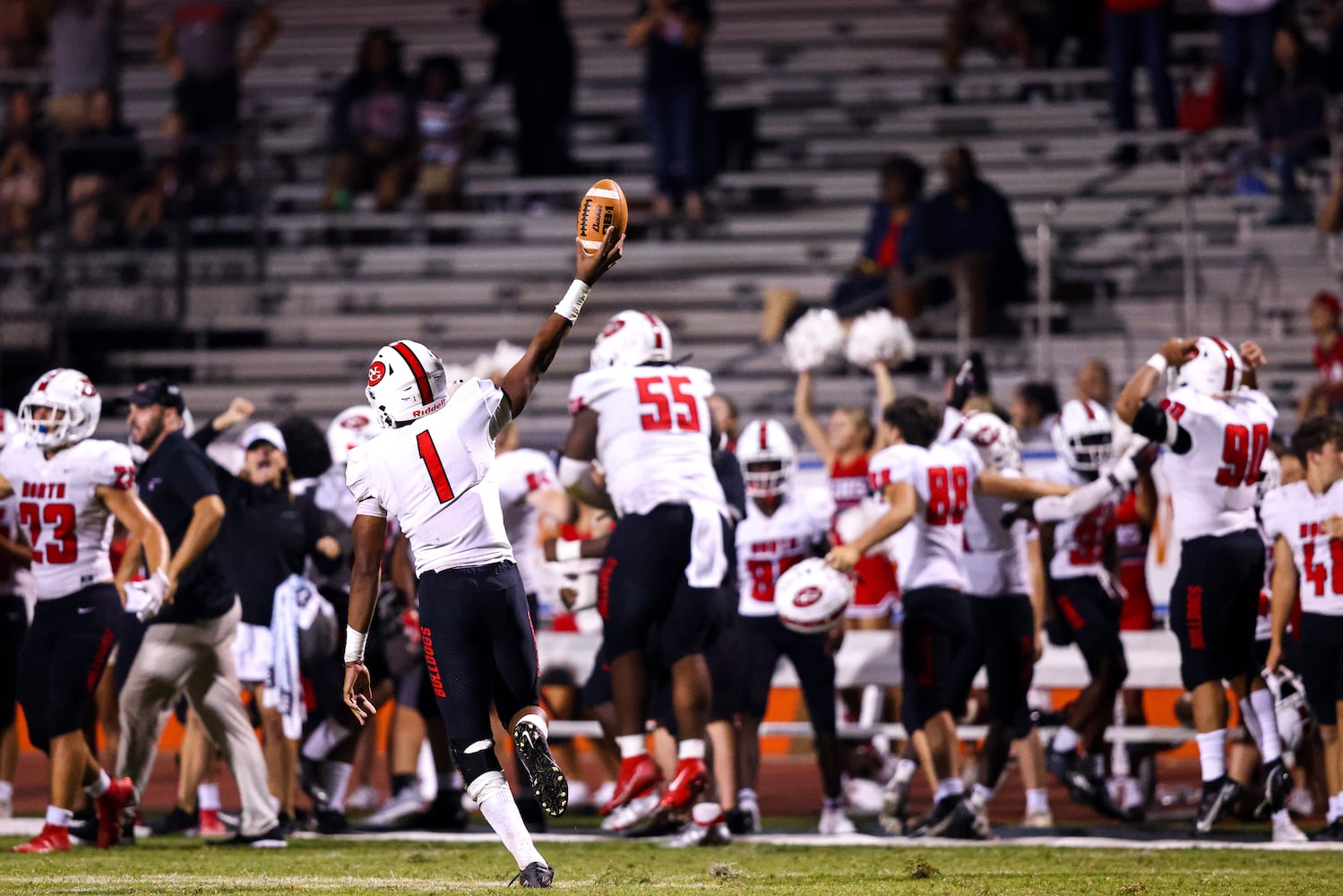 North Gwinnett linebacker Grant Godfrey (1) holds up the ball after a big turnover during a GHSA 7A high school football game between the North Gwinnett Bulldogs and the Parkview Panthers at Parkview High School in Lilburn, Ga., on Friday, Sept. 3, 2021. (Casey Sykes for The Atlanta Journal-Constitution)