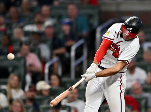 Atlanta Braves first baseman Matt Olson (28) hits a solo home run during the sixth inning at Truist Park. (Hyosub Shin / Hyosub.Shin@ajc.com)