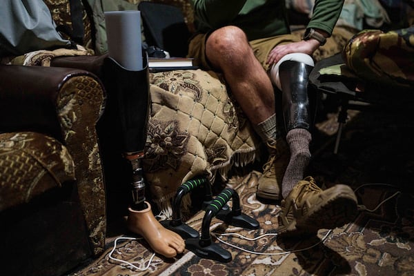 Maksym Vysotskyi, a drone unit commander with Ukraine's 82nd assault brigade, sits on a sofa near the front line in Ukraine's Kharkiv region on Feb. 2, 2025. (AP Photo/Evgeniy Maloletka)