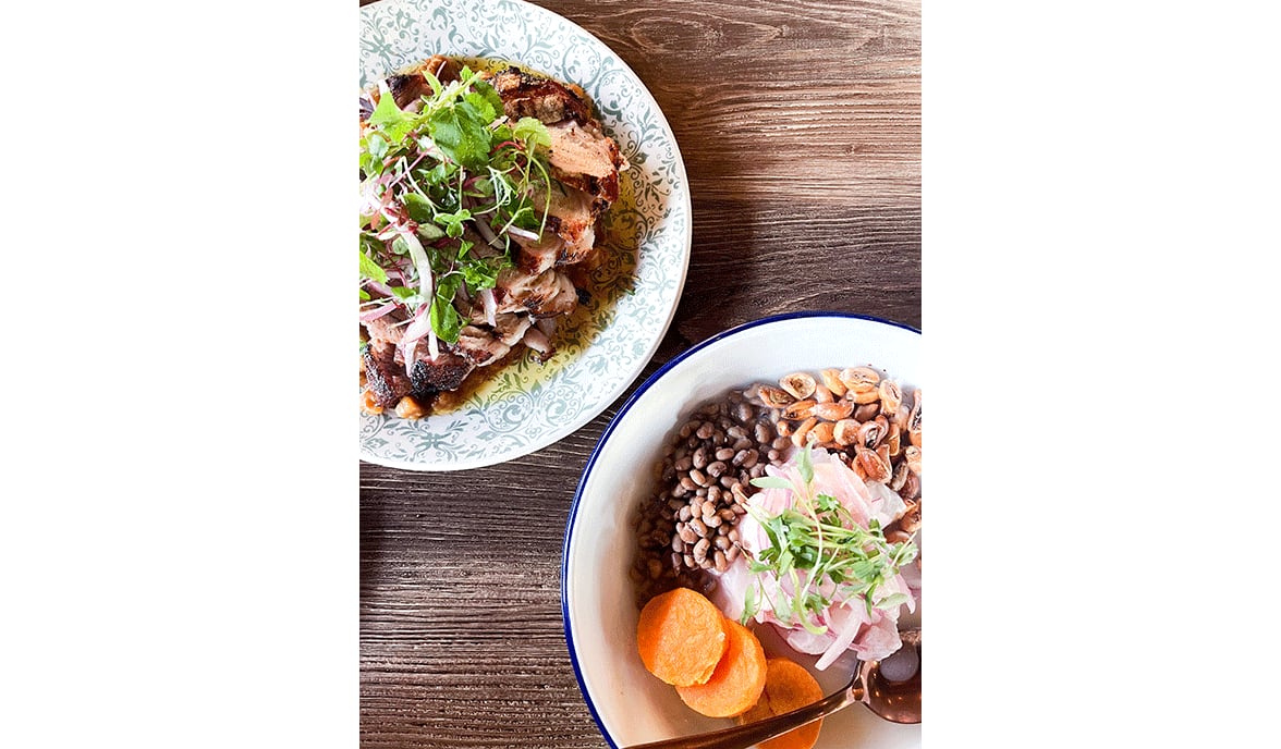 Chuleta de Puerco made with Stone Mountain Cattle bonein pork chop, carapulcra and salsa criolla and Ceviche de Pescado made with Gulf Snapper, sweet potato, Sea Island red peas, cancha corn, onions, aji limo leche de tigre from the menu of Tio Lucho's.