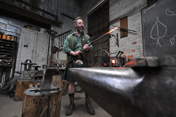 May 11, 2021 Atlanta - Mark Johnstone Hopper, works on a metal leaf at his studio, Goat n Hammer, in Atlanta on Tuesday, May 11, 2021. (Hyosub Shin / Hyosub.Shin@ajc.com)