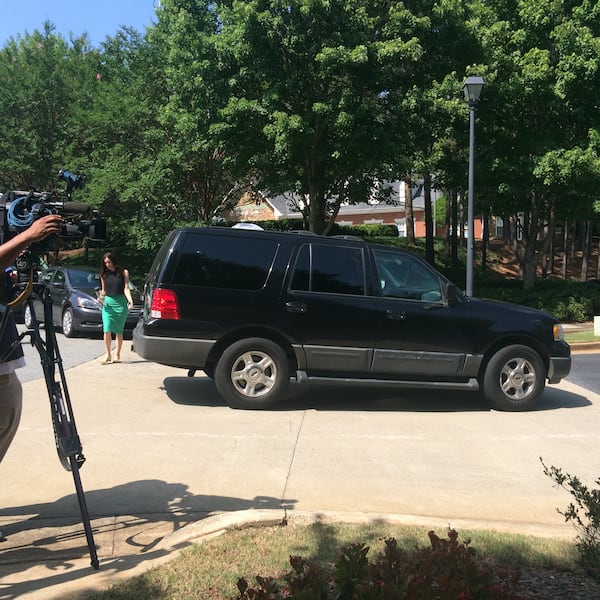 Family members have been arriving as media and police vehicles sit outside. Photo: Jennifer Brett