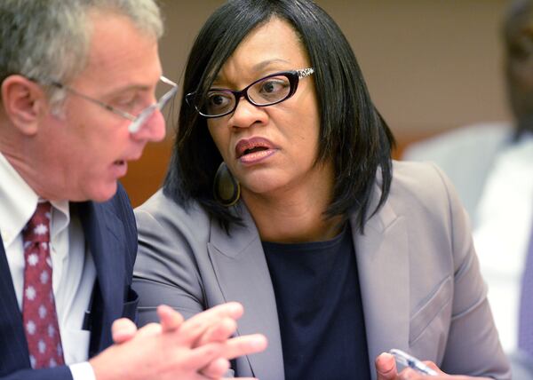 Former Dobbs Elementary School principal Dana Evans talks with her lawyer, Bob Rubin. (Kent D. Johnson / AJC file photo / September 2015)