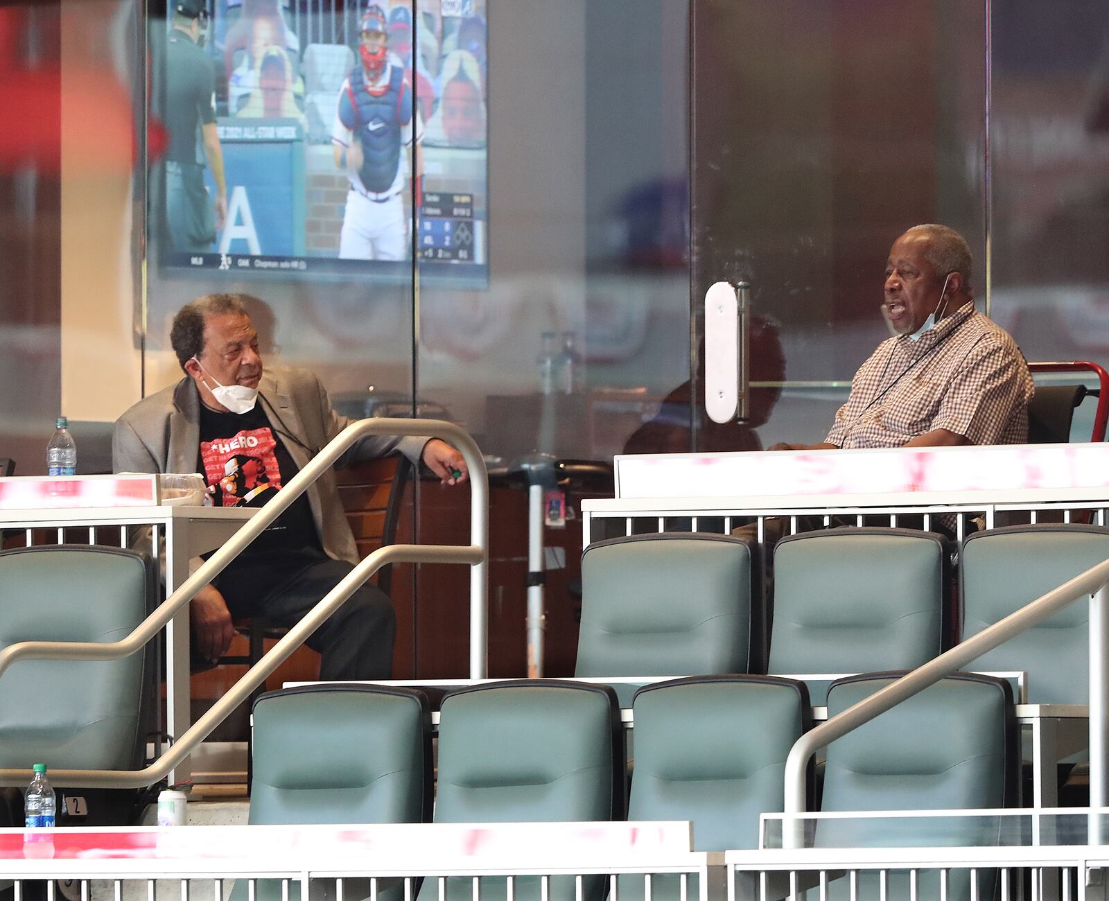 072920 Atlanta: Andy Young (left) and Hank Aaron social distance with masks while watching the Atlanta Braves  home opener on Wednesday, July 29, 2020 in Atlanta.    Curtis Compton ccompton@ajc.com