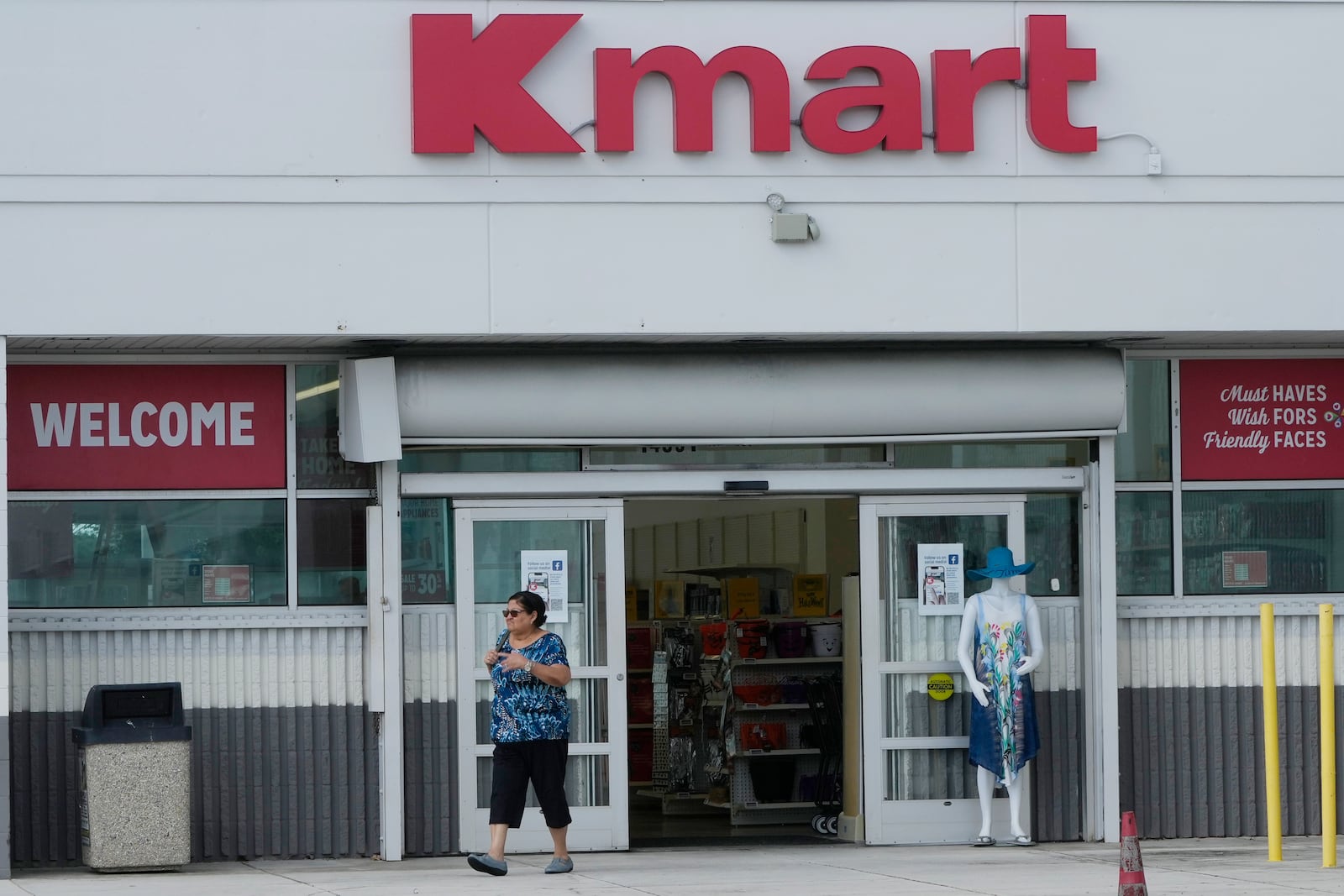 A customer exits the only Kmart store left in the continental United States, Tuesday, Oct. 22, 2024, in Miami. (AP Photo/Marta Lavandier)