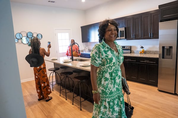 The family of Hattie B. Dorsey, founder of Atlanta Neighborhood Development Partnership Inc, tours a new condo at an unveiling event on Tuesday, Aug. 27, 2024 in Atlanta, Georgia. (Olivia Bowdoin for the AJC). 