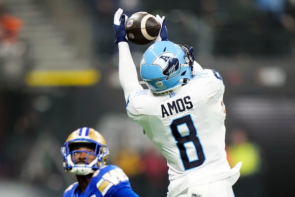 Toronto Argonauts' DaShaun Amos (8) makes an interception against the Winnipeg Blue Bombers during the second half of a CFL football game at the 111th Grey Cup in Vancouver, British Columbia, Sunday, Nov. 17, 2024. (Frank Gunn/The Canadian Press via AP)