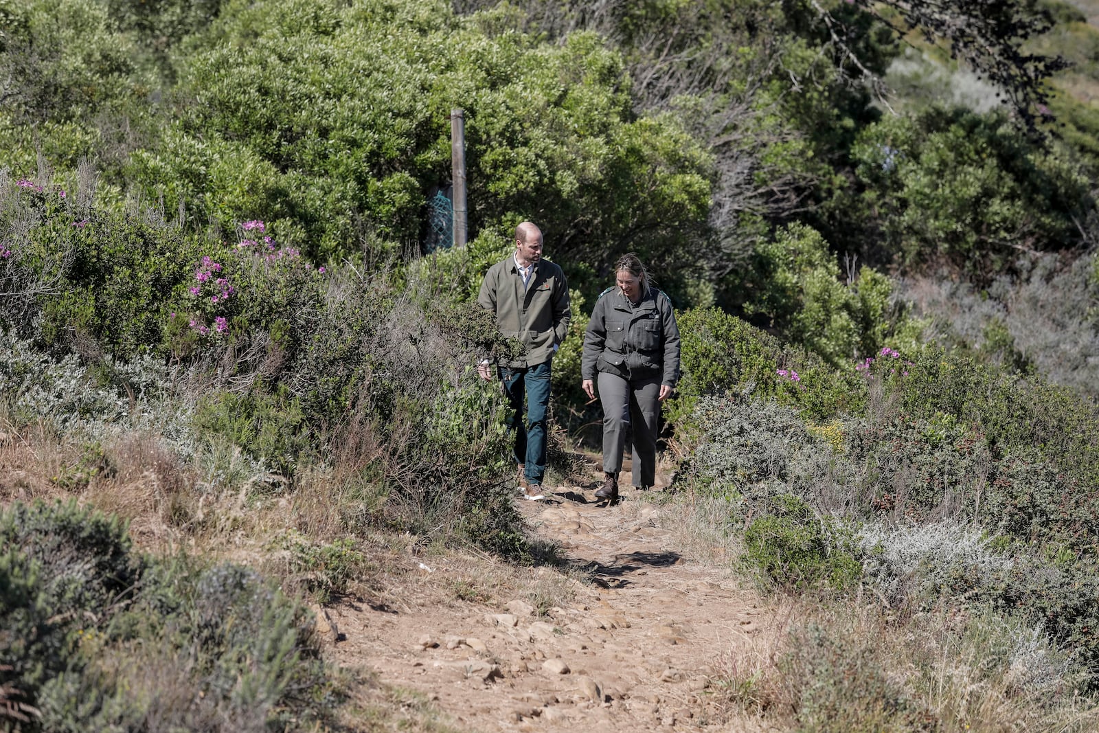 Britain's Prince William, left, talks with Park Manager for Table Mountain National Park Megan Taplin, right, while visiting Signal Hill in Cape Town, South Africa, Tuesday, Nov. 5, 2024. (Gianluigi Guercia/Pool via AP)