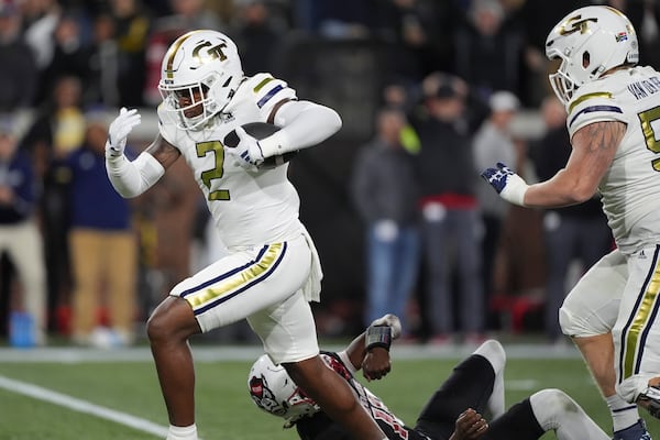 Georgia Tech linebacker E.J. Lightsey (2) runs in a touchdown after an interception during the first half of an NCAA college football game North Carolina State, Thursday, Nov. 21, 2024, in Atlanta. (AP Photo/Brynn Anderson)