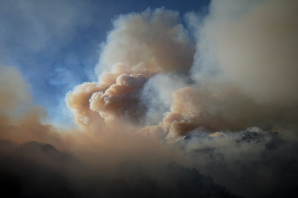 The Franklin Fire sends a plume of smoke into the sky Tuesday, Dec. 10, 2024, in Malibu, Calif. (AP Photo/Eric Thayer)