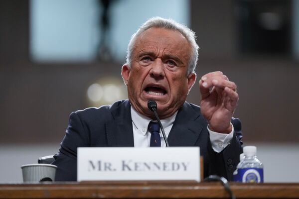 Robert F. Kennedy Jr., President Donald Trump's choice to be Secretary of Health and Human Services, appears before the Senate Finance Committee for his confirmation hearing, at the Capitol in Washington, Wednesday, Jan. 29, 2025. (AP Photo/Ben Curtis)