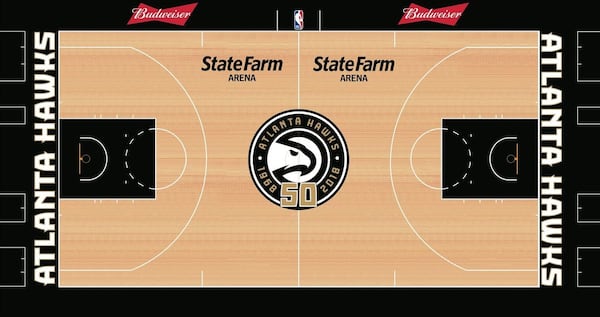 The Hawks unveiled a secondary court featuring gold and black colors that will be used for several games as part of the team’s 50th anniversary celebration. (COURTESY THE ATLANTA HAWKS)