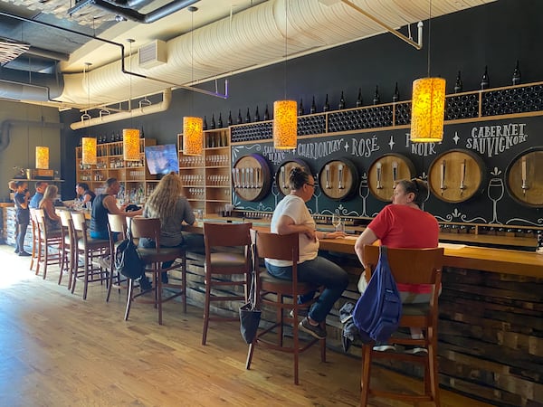 A handful of City Winery patrons enjoy a drink at the bar. (Ligaya Figueras / ligaya.figueras@ajc.com)