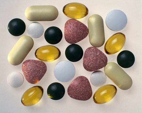 UNITED KINGDOM - NOVEMBER 27:  By the 1920s links had been made between vitamins in foods and diseases, demonstrating the need for a balanced diet. Food supplements were developed to make it easier for people to get their essential vitamins and minerals. In recent years there has been debate about the benefits of taking food supplements. Vitamins A, C and E are thought to prevent a number of disorders including cancer and heart disease, and vitamin C is also taken to ward off colds. Vitamin D and calcium are believed to be essential in the formation of healthy skin and bones, while B vitamins and folic acid are thought to regulate mood and prevent depression and dementia. The manufacture of vitamins and food supplements is now a multi-million pound industry.  (Photo by SSPL/Getty Images)