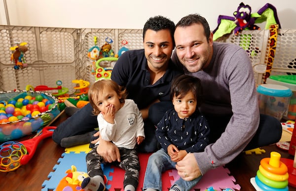 Elad Dvash-Banks, left, and his husband, Andrew, right, with their twin boys Ethan and Aiden at home in Los Angeles on January 26, 2018. The brothers were born minutes apart 16 months ago in Canada, but only Aiden received U.S. citizenship.