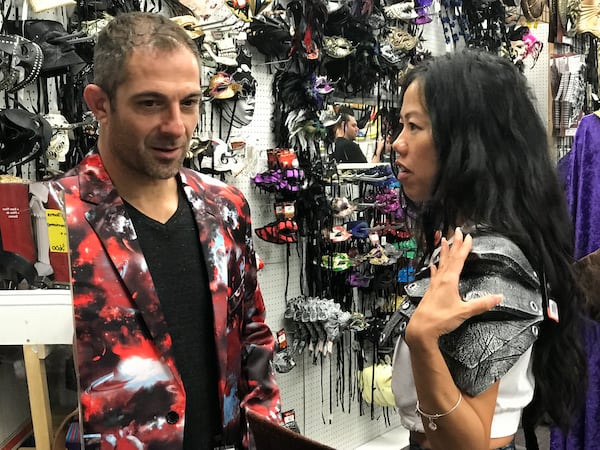 Brian Levine and Eileen Chua of California shop at Costumes Etc. as they prepare to go to Dragon Con. CREDIT: Shelia Poole