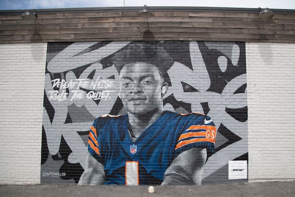 06/04/2021 — Kennesaw, Georgia — A mural of NFL quarterback and Kennesaw native Justin Fields is displayed on the exterior of Pisano’s Pizzeria and Italian Kitchen in Kennesaw, Friday, June 4, 2021.  (Alyssa Pointer / Alyssa.Pointer@ajc.com)