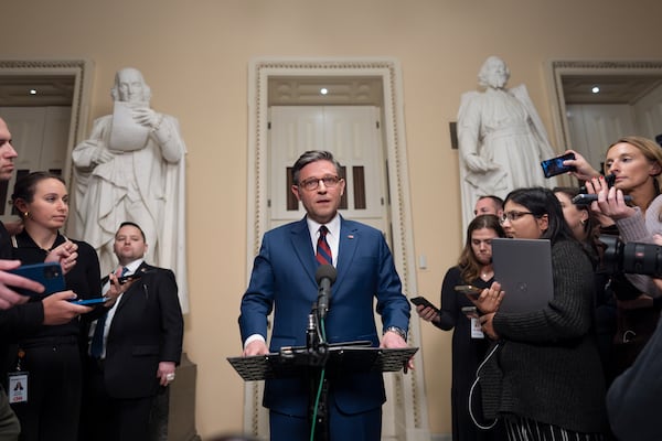 House Speaker Mike Johnson, a Republican from Louisiana, talks with reporters at the Capitol before a vote on an interim spending bill on Thursday. The measure failed.