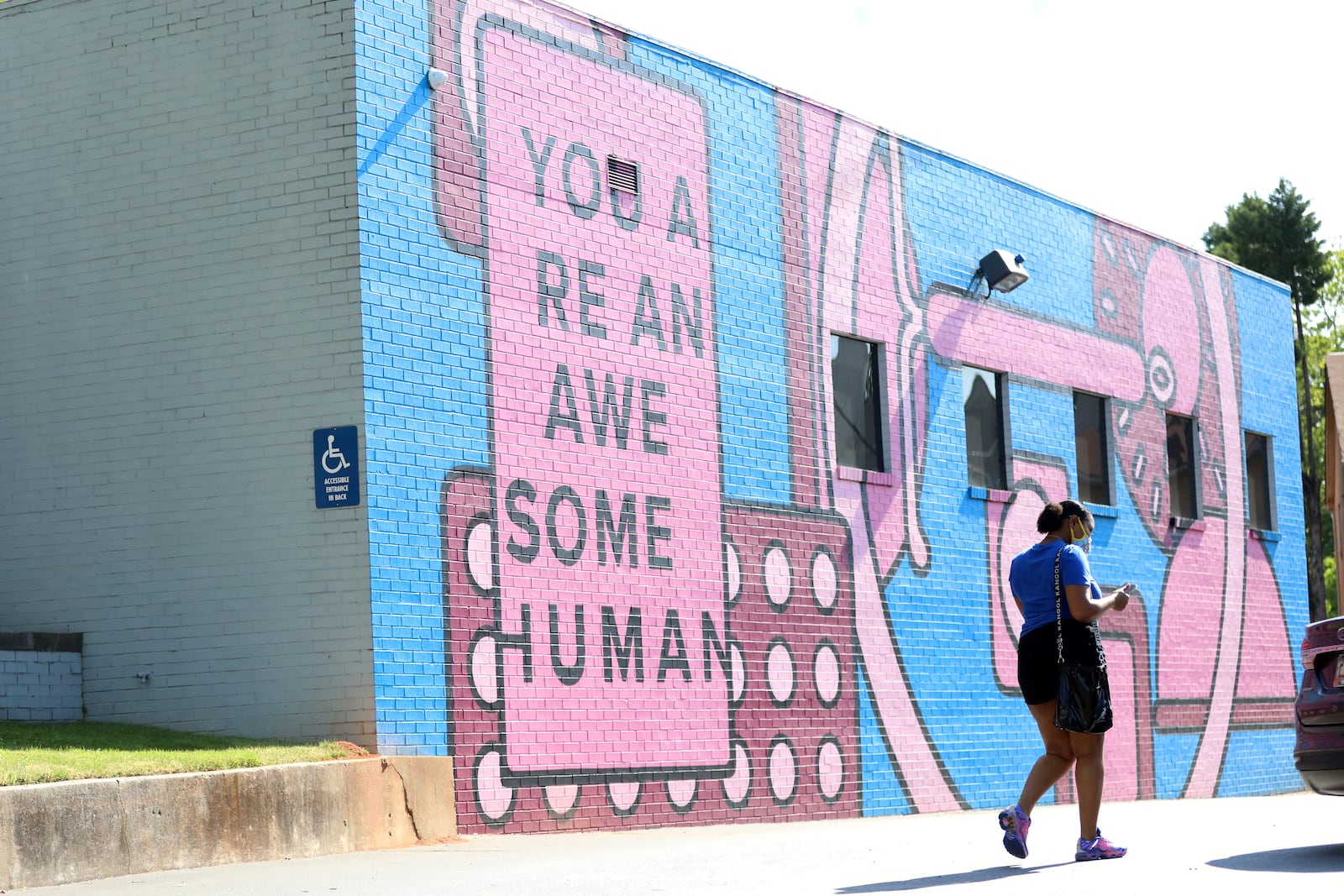 A woman walks outside the Planned Parenthood offices in Atlanta in May 2022, a day after word leaked that a draft Supreme Court decision could strike down the constitutional right to an abortion. The court then issued that decision a month later. Miguel Martinez /miguel.martinezjimenez@ajc.com