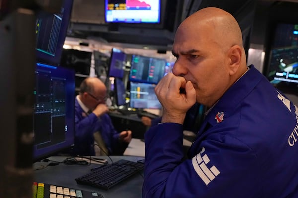 Specialist Philip Finale works on the floor of the New York Stock Exchange, Tuesday, March 11, 2025. (AP Photo/Richard Drew)